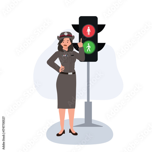 female police officer managing traffic with pedestrian signal for road safety.