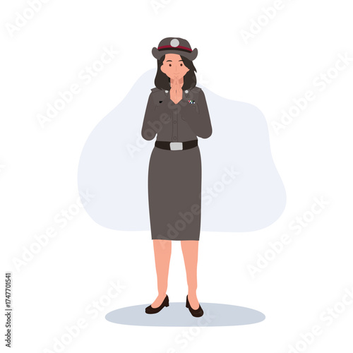 female thai police officer standing and greeting in official uniform showing respect and tradition in thailand culture