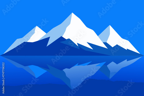 Three snow capped mountains reflecting in the water