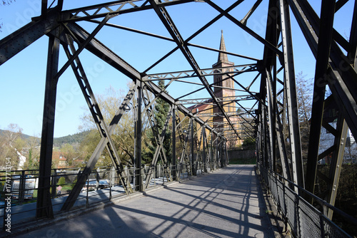Metal bridge next to the Schiltach Church in Germany