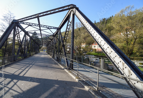 Metal bridge next to the Schiltach Church in Germany
