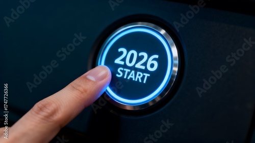 Finger pressing illuminated 2026 start button