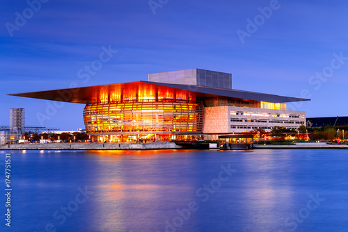 Photography Modern, futuristic Danish National Opera building in Copenhagen at dusk