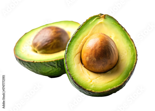 Vibrant green avocado halves revealing creamy flesh and large brown seed against a stark black background