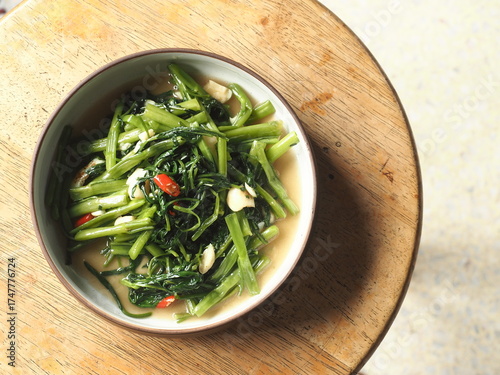 dish of stir fried morning glory or water spinach with garlic and chili