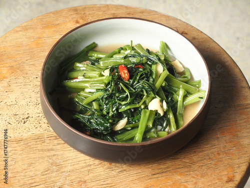 dish of stir fried morning glory or water spinach with garlic and chili