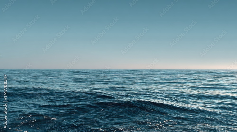 Fototapeta premium Calm Ocean Surface with Clear Sky and Serene Water Reflection