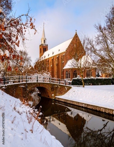 Winter scene of a church with a bridge and snow-covered grounds