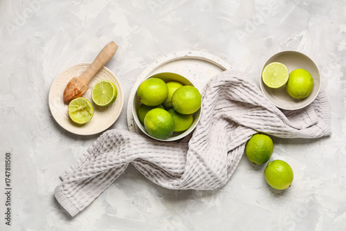 Fresh green limes and woode...