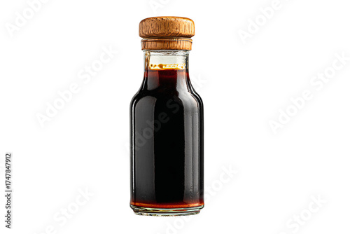 Small glass bottle of dark liquid with a wooden cork stopper.
