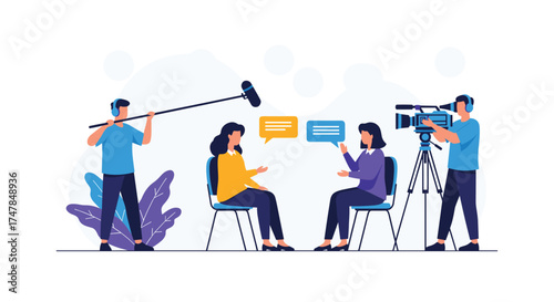 Two people sitting on chairs facing each other for an interview recording with sound boom and video camera.