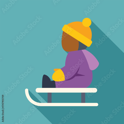 Child wearing winter clothes sitting on sled enjoying winter activity