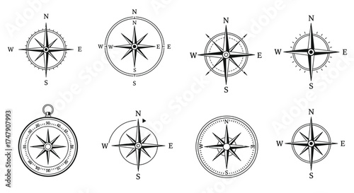 Collection of vintage compass roses and navigational instruments shown in black
