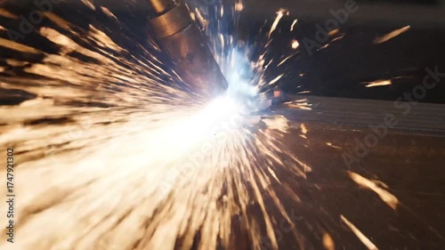 Macro View Intense Welding Sparks on Dark Steel Surface with Industrial Equipment Creates a Dramatic Light Display and Dynamic Texture and Patterns Metalworking Process 180-200