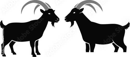 Two black goats with large curved horns standing in silhouette, bold livestock farm animal vector design for rural artwork and logosWeb