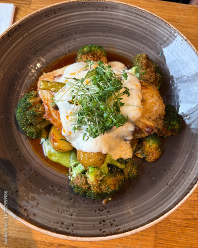 Fish and broccoli with creamy sauce.
