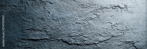 Textured,  dark gray surface with subtle variations in tone