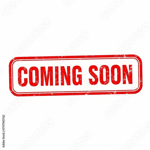A rectangular sign with rounded corners displaying the words coming soon in red on a white background
