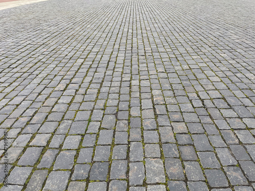 Abstract background. Old cobblestone pavement closeup