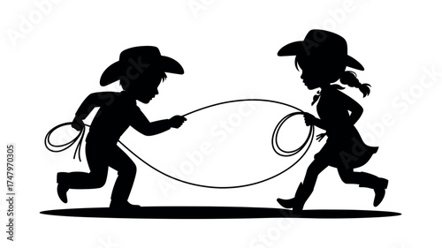 Adorable silhouette of a young cowboy and cowgirl playing together, running and jumping rope in a classic western theme