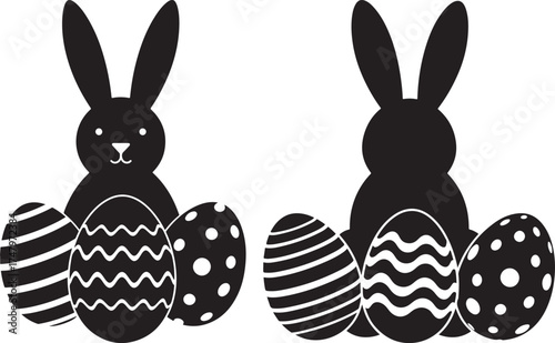 Two easter bunny silhouettes with decorated eggs isolated on white background