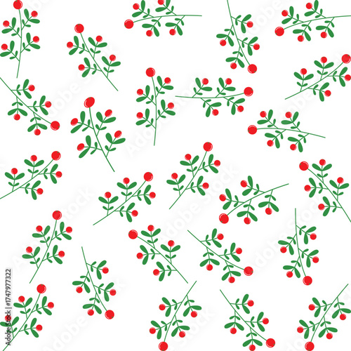 Green leaves with bright red berries on white background bring a fresh and cozy winter vibe.