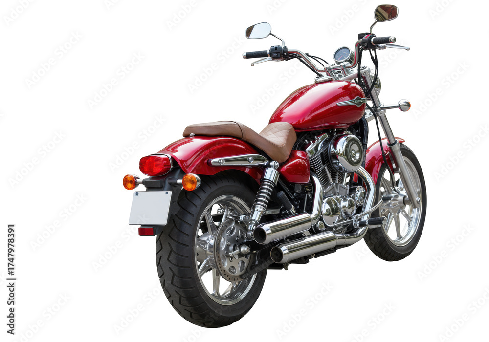 Obraz premium Isolated vintage red cruiser motorcycle from a low angle, showing retro chrome exhaust pipes