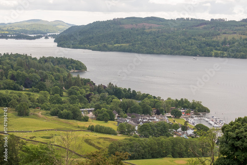 Typical Lake District landscape with lake Windermere, houses, boats, fields and forests in Cumbria, England