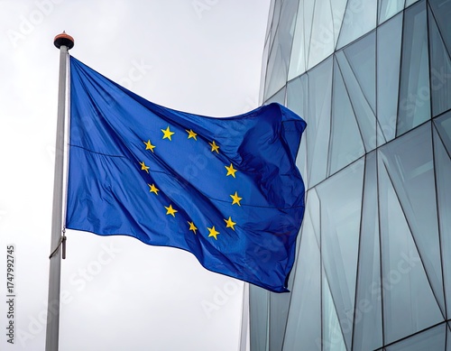 European Union flag waving against a modern building