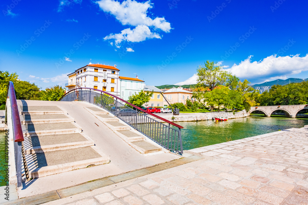 Fototapeta premium Urban landscape with bridge over canal in town of Crikvenica, Croatia 