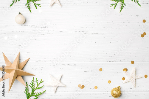 Festive Christmas background with Christmas decorations on white wooden table. Top view. Copy space for text.