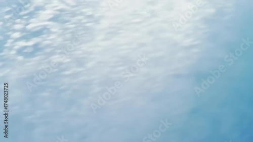 A close-up view of a powerful ocean wave, capturing its translucent, curling form