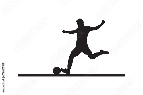 Silhouette shows a soccer player kicking the ball during a match with determination