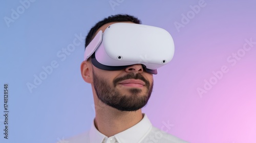 Middle Eastern man using white VR headset smiling under lavender blue gradient light futuristic studio