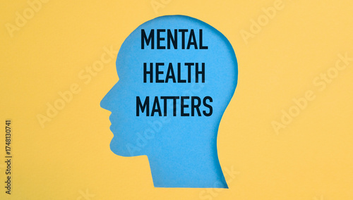Obraz na plátně Text Mental Health Matters on the background of a human head figure on a yellow background