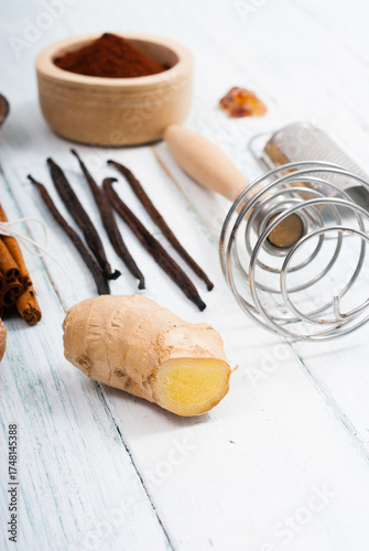 ginger root and dessert ingredients on white wooden