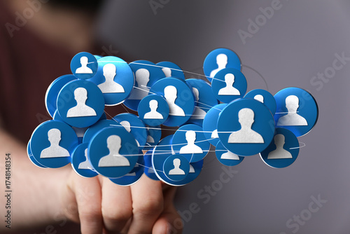 Hand holding a network of p...