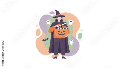 Creative Halloween filmmaker in witch costume with pumpkin and clapperboard