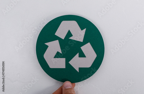 A hand holding the green re...