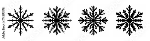 Four distinct intricate snowflake patterns each with unique crystalline ice formations and fractal designs