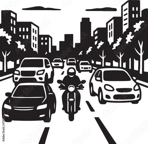 Motorcycle rider in traffic between cars on city street