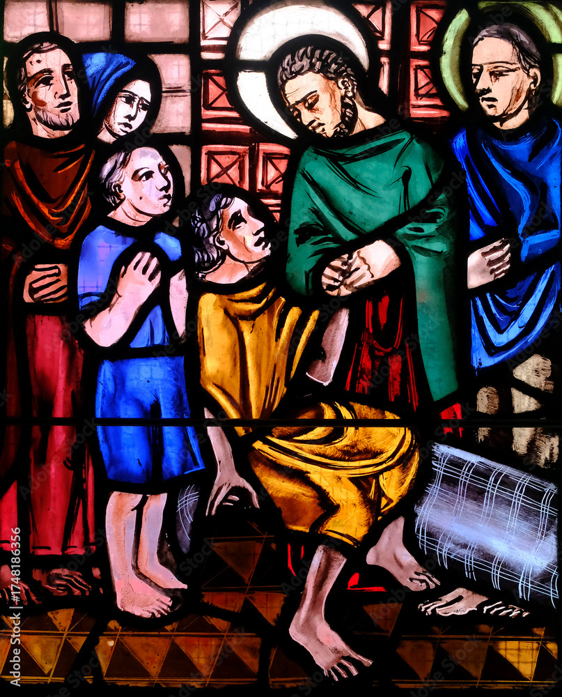 Fototapeta premium Saint-Pierre de Pernef church. Stained glass. Life of Peter the apostle. Saint Peter heals a sick person at the gate of Jerusalem. France.