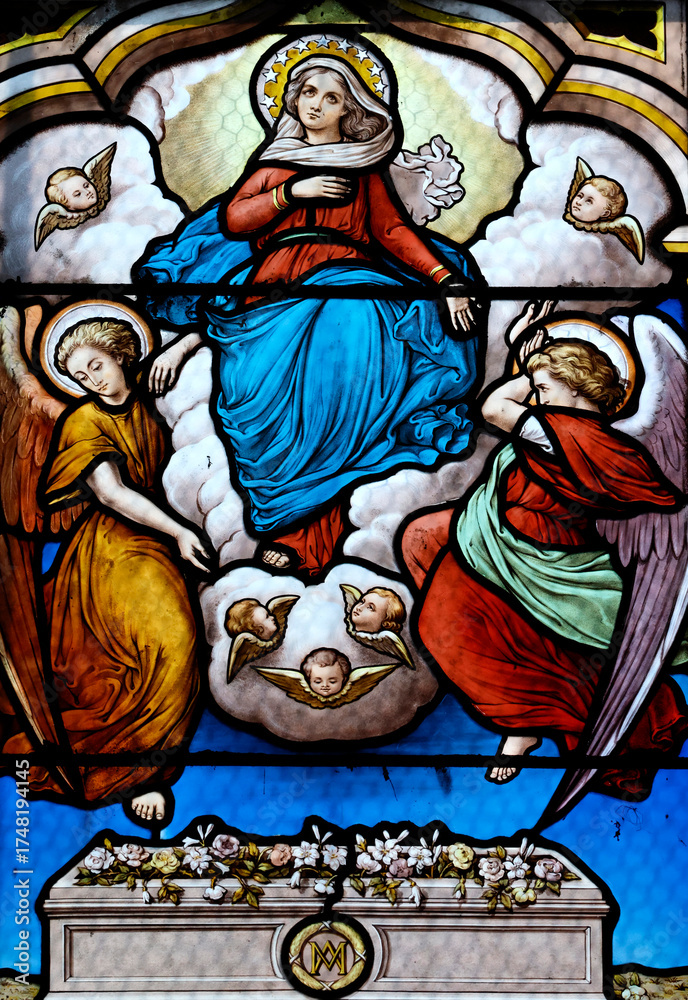 Obraz premium Saint Seine church. Stained glass. The Assumption of Mary into Heaven. Corbigny. France.