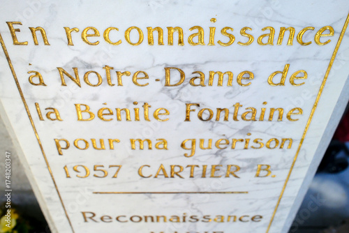 Marble ex-voto plaque with golden words of gratitude to Notre-Dame de la Benite Fontaine, 1957. La Roche sur Foron.  France.
