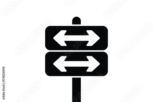 Black and white directional sign with two arrows pointing left and right