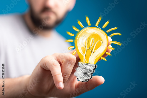 Person holding glowing ligh...