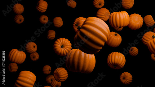 Close-up of falling pumpkins against black background