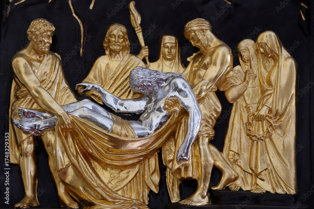 Obraz premium My Tho cathedral. Way of the cross. Station 13. Jesus is taken down from the cross. My Tho. Vietnam.