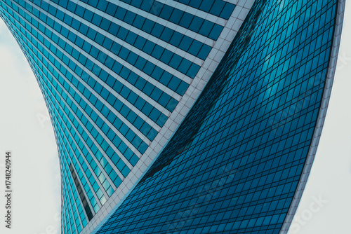 Obraz na plátne mirrored windows of the facade of an office building