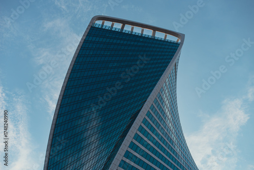 Фотография mirrored windows of the facade of an office building